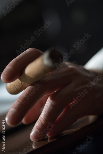 Cigar in hand closeup