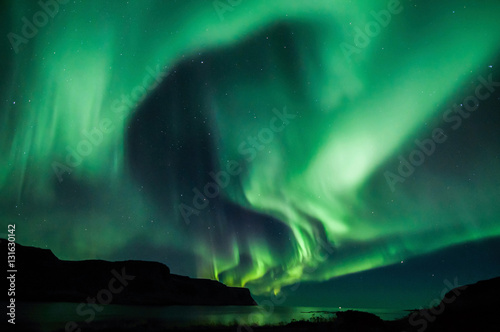 Northen lights (Aurora Borealis) in Iceland over the fjord © MikeHubert