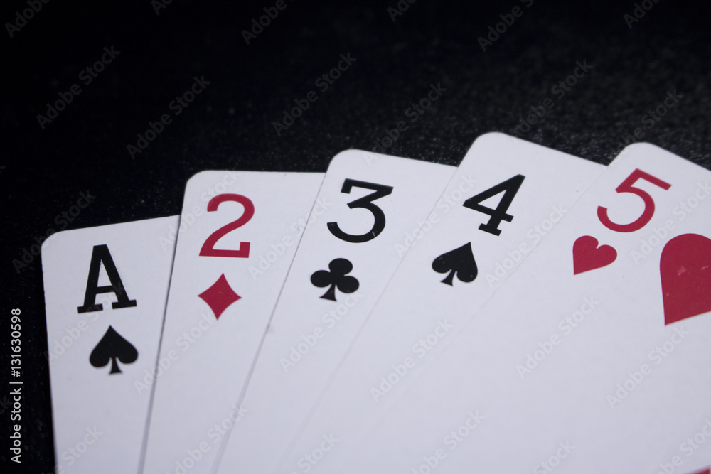 straight poker card on dark black background straight poker card on dark black background