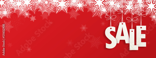Suspended SALE letters on red background with snowflakes