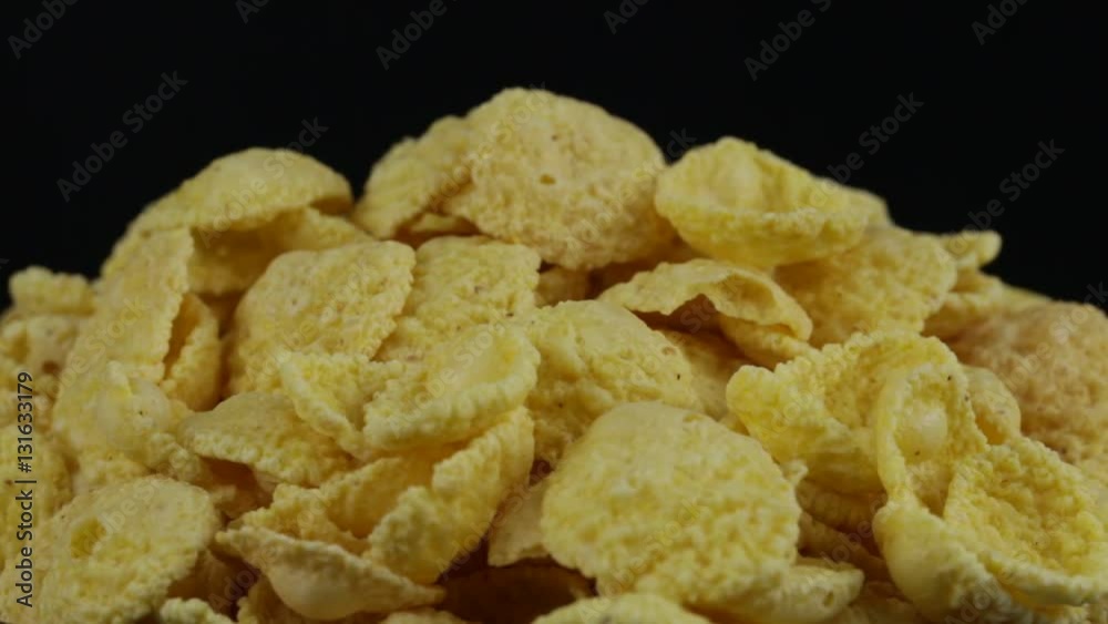 Rotating corn chips close up, macro view food background Rotating corn chips close up, macro view food background