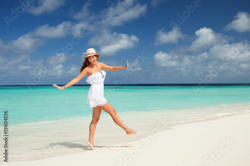 Wallpaper Mural Fashion woman dancing on the beach. Happy island lifestyle. Whit Torontodigital.ca