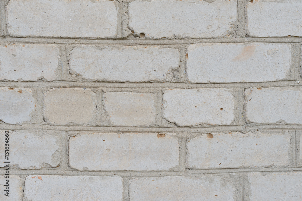 Fototapeta premium Brick texture with scratches and cracks