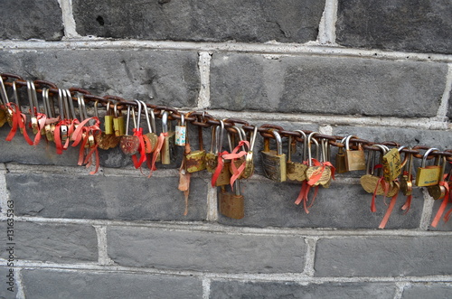 love symbol padlocks chained on the Great Wall