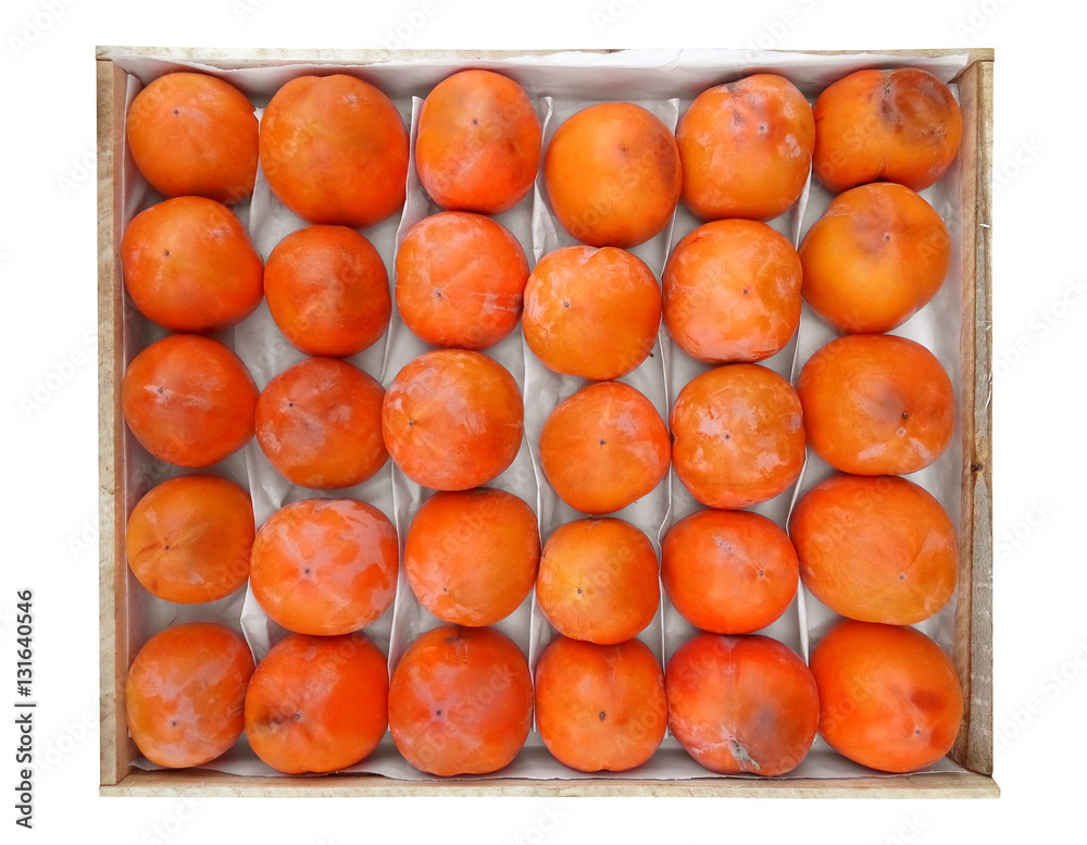 Persimmon fruit in the wooden box