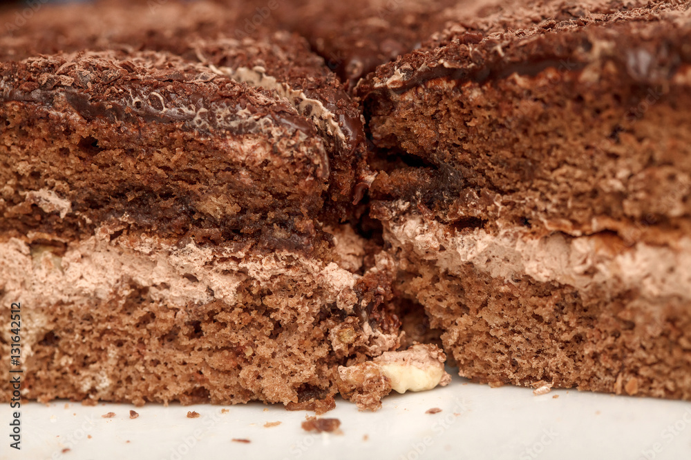 Slices of chocolate cake with cream closeup Slices of chocolate cake with cream closeup