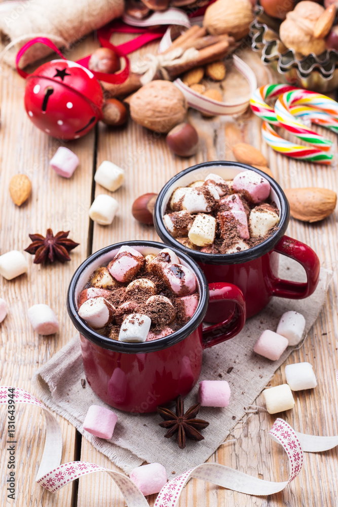 Hot chocolate with marshmallows and spices on christmas table Hot chocolate with marshmallows and spices on christmas table