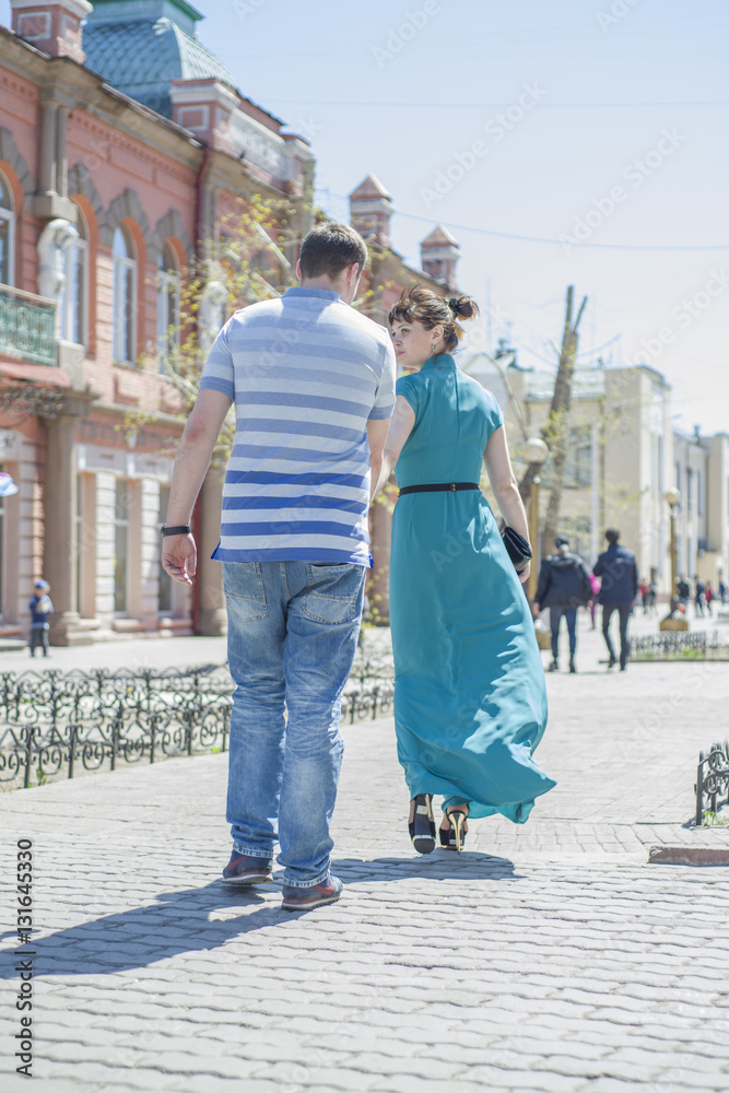 The couple walks around the city.