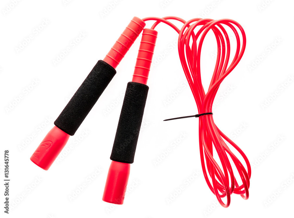 Red jump rope or skipping rope isolated on white background. Red jump rope or skipping rope isolated on white background.