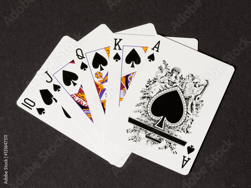 Fotografía Royal flush of spades on black canvas