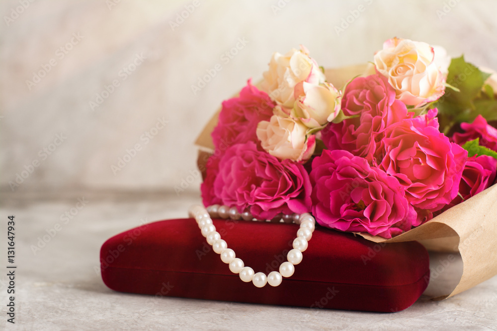 Pearl necklace and roses bouquet Pearl necklace and roses bouquet