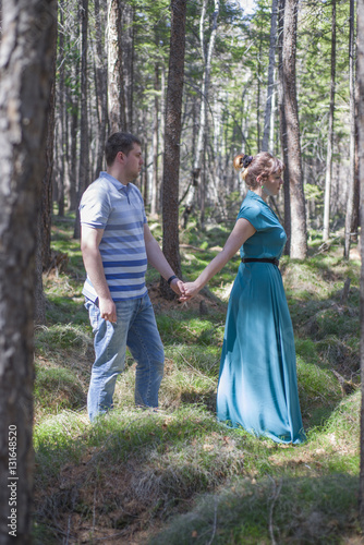Couple in love walking in the woods.
