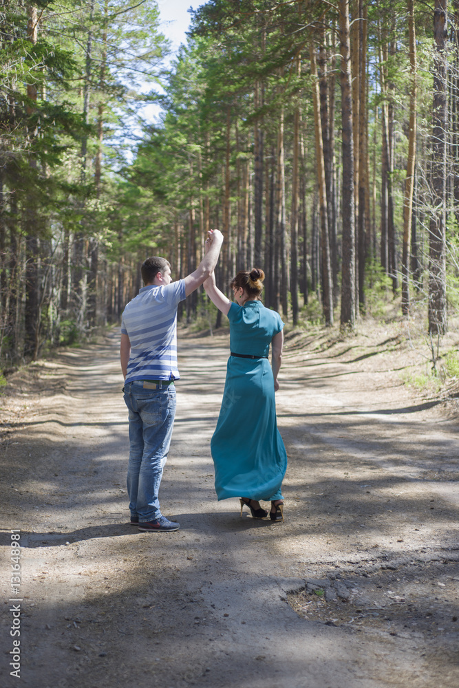 Fototapeta premium Couple in love walking in the woods.