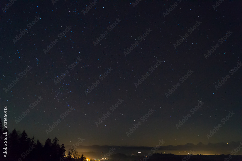 Stars at night, Swiss Alps in horizon