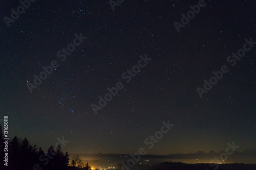 Stars at night, Swiss Alps in horizon