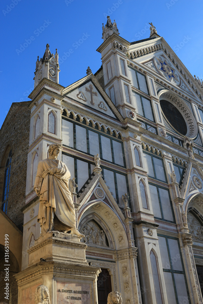 Dante Alighieri statue and Basilica of the Holy Cross in Santa Croce square in Florence, Italy
