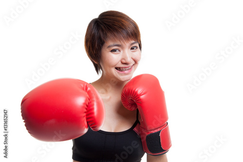 Beautiful healthy Asian girl with red boxing glove. © halfbottle