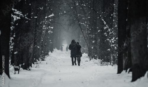 People walk on the winter alley