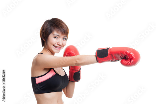 Beautiful healthy Asian girl with red boxing glove.