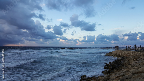 Sunset, on promenade of Mediterranean Sea, winter, Haifa, Israel