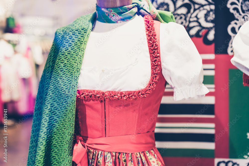 Traditional red dress with white shirt and knit scarf