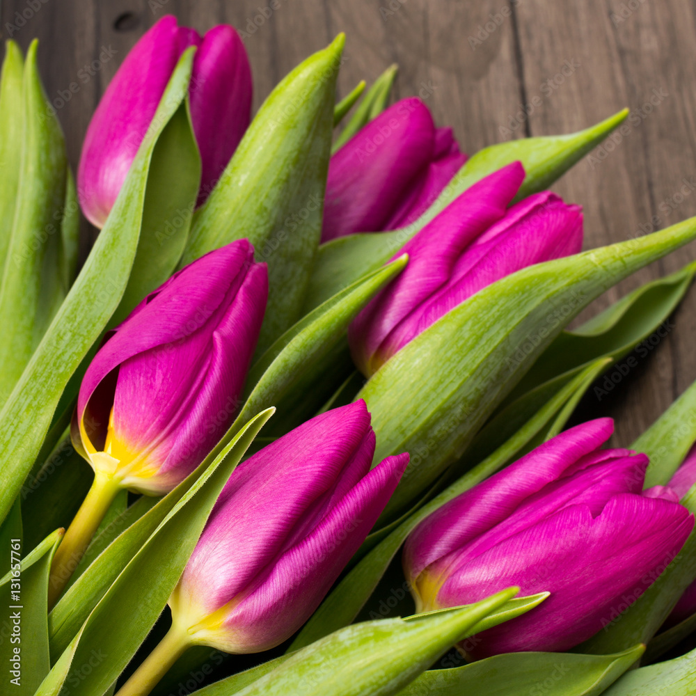 tulip bouquet on black wooden background tulip bouquet on black wooden background