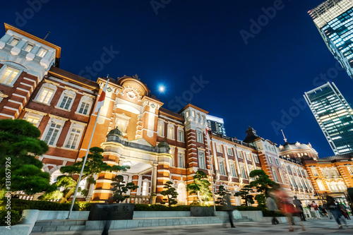 Asia Business concept for real estate and corporate construction - panoramic modern cityscape building bird eye aerial night view of Tokyo Station under neon light and dark blue sky in Tokyo  Japan