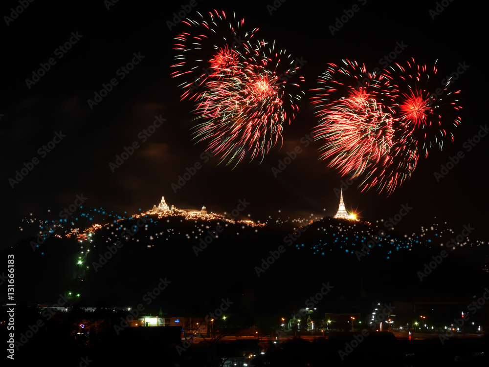 Fireworks displaying over  the mountain..Colourful firework festival blowing up in sky celebrating for two temples on the hill.