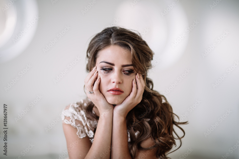 portrait of the bride crying, sadness, streaks of ink. Natural light portrait of the bride crying, sadness, streaks of ink. Natural light
