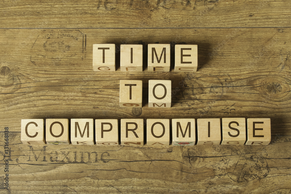 time to compromise text on cubes on wooden background