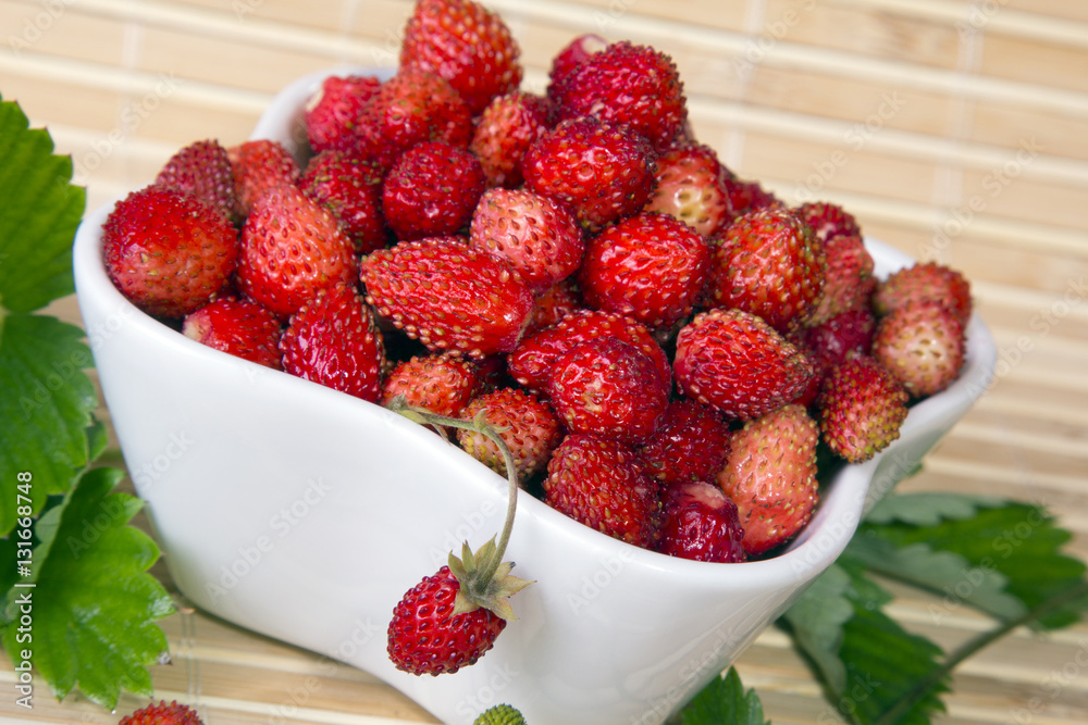 Wild strawberries in a small bowl Wild strawberries in a small bowl