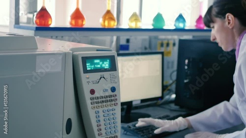 Wallpaper Mural Woman typing on a computer keyboard in the lab. Torontodigital.ca