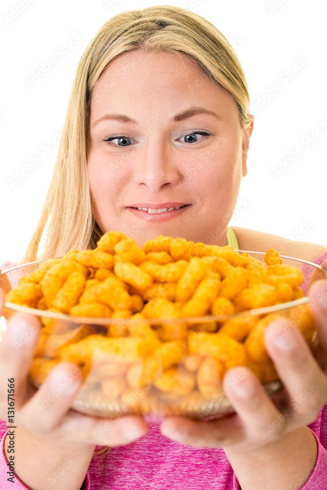 Smiling woman with bowl full of unhealthy crisps. Smiling woman with bowl full of unhealthy crisps.