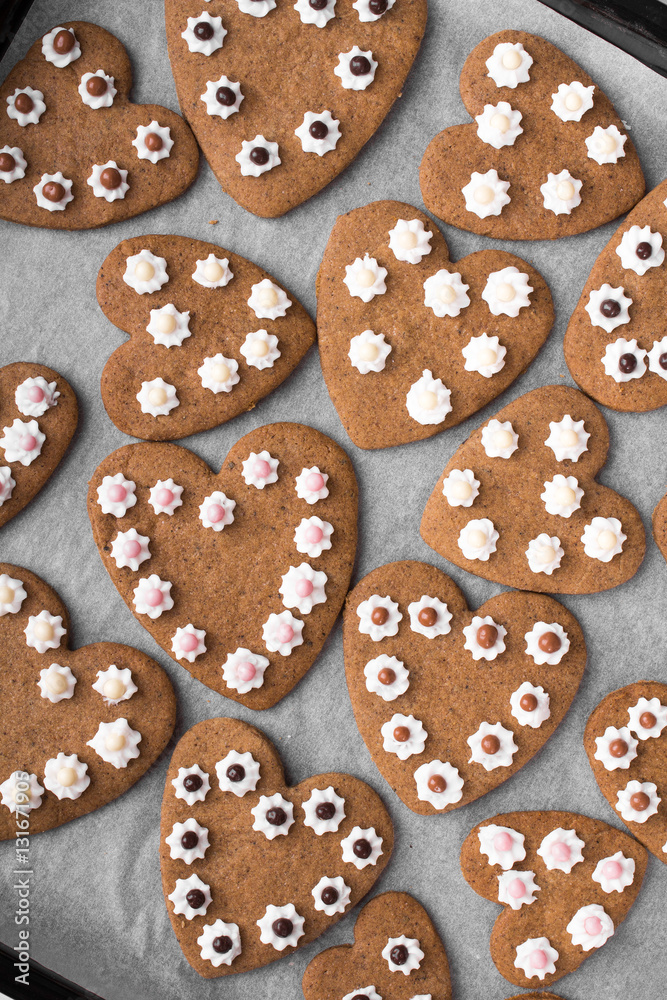Heart shaped cookies on baking paper background Heart shaped cookies on baking paper background