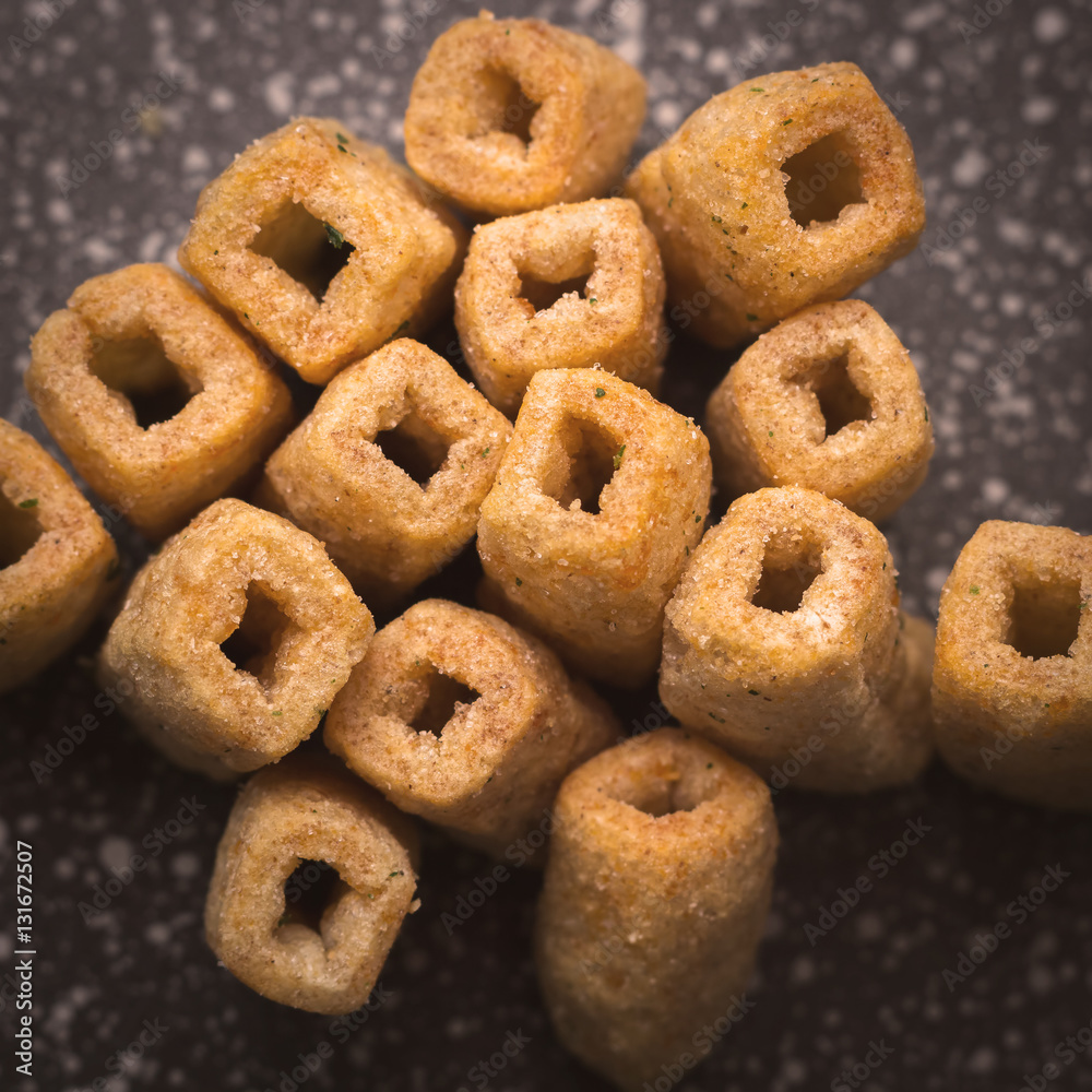 Chips of wheat flour in the form of tubes. Close-up. Top view Chips of wheat flour in the form of tubes. Close-up. Top view