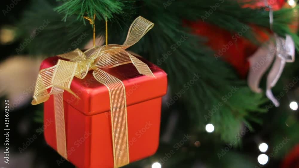 multi-colored Christmas toys red box on Christmas barely in the room multi-colored Christmas toys red box on Christmas barely in the room
