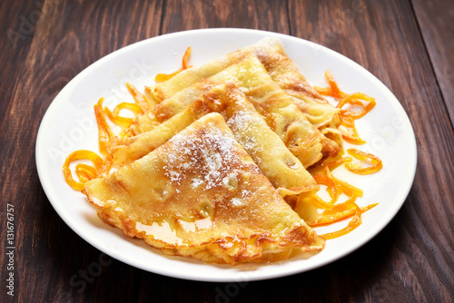 Crepes with orange sauce
