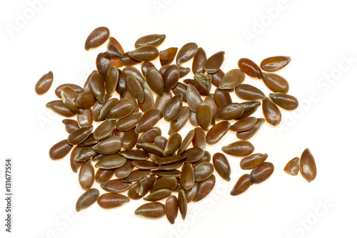 closeup of flax seeds isolated on white background