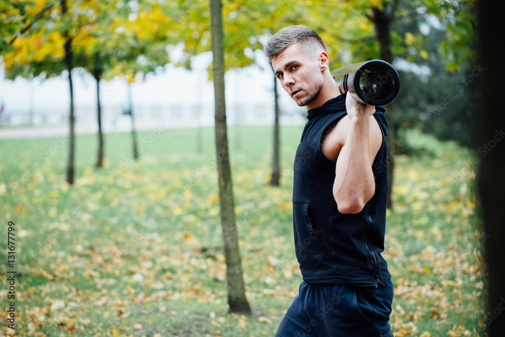Male fitness doing exercise lunge with vipr, morning workout in the park. Male fitness doing exercise lunge with vipr, morning workout in the park.