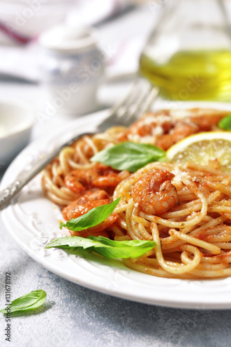 Spaghetti with shrimps in a tomato sauce.