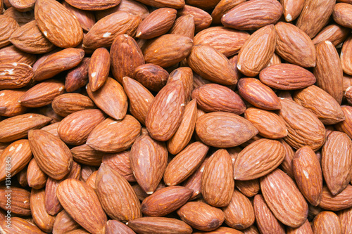 Peeled almonds background or texture