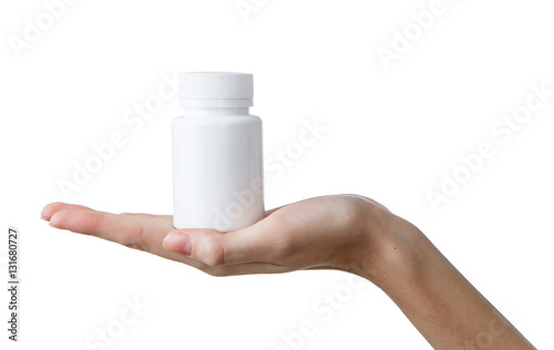 Woman's hands with white bottle for medical pills isolated on white background. Palm up, close up.
