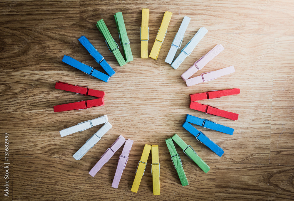 colorful wooden clothespin on wooden background colorful wooden clothespin on wooden background