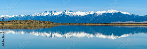 Canvas Print Sangre de Cristo Mountains - Panoramic view of Snow-capped Sangre de Cristo Mountains, reflecting in San Luis Lake