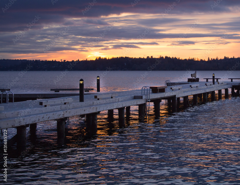 A diagonal view of a pier on a lake in a winter sunset at Waverly Beach Park, Washington