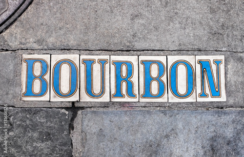 New Orleans sidewalk tiled letters for Bourbon Street in the French Quarter