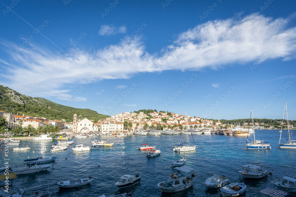 The busy and popular port town of Hvar Town, Croatia in the late afternoon sun on a summer's day.
