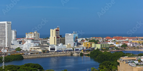 Walled city along the sea in Cartagena, Colombia. Panorama of the city with colorful old and modern buildings. © avmedved