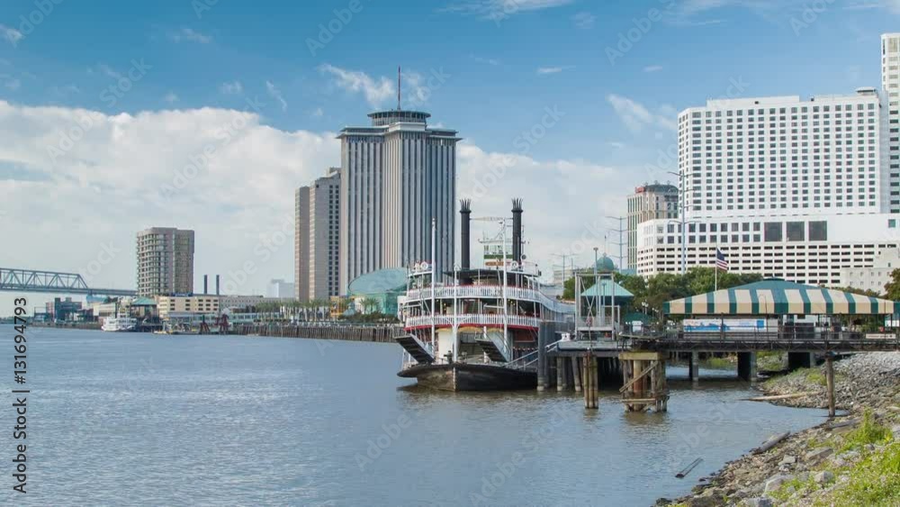 Mississippi Riverfront at the French Quarter in New Orleans LA at Moonriver Walk / Waldenberg Park featuring the Natchez Steamboat and Hotels on an Idyllic Louisiana Morning Mississippi Riverfront at the French Quarter in New Orleans LA at Moonriver Walk / Waldenberg Park featuring the Natchez Steamboat and Hotels on an Idyllic Louisiana Morning
