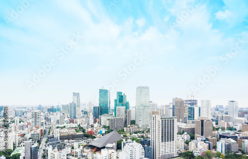 Business and culture concept - panoramic modern city skyline bird eye aerial view from tokyo tower under dramatic morning blue cloudy sky in Tokyo  Japan